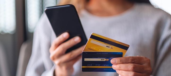 A Woman Using Credit Card For Purchasing And Shopping Online On Mobile Phone